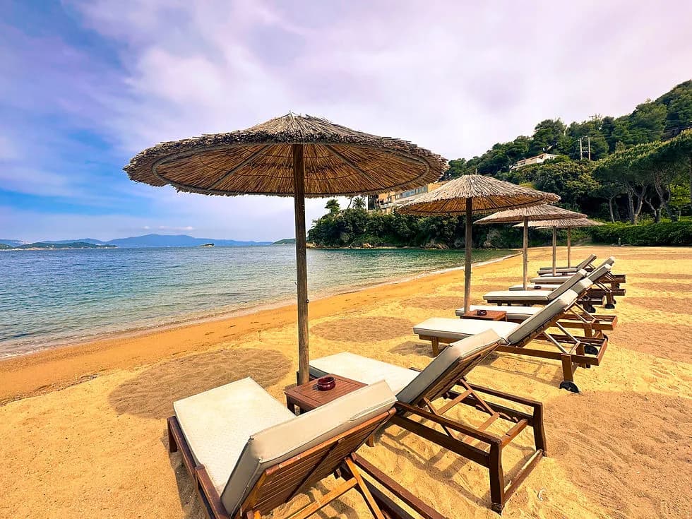 Beach clubs and coastline in Skiathos, Greece