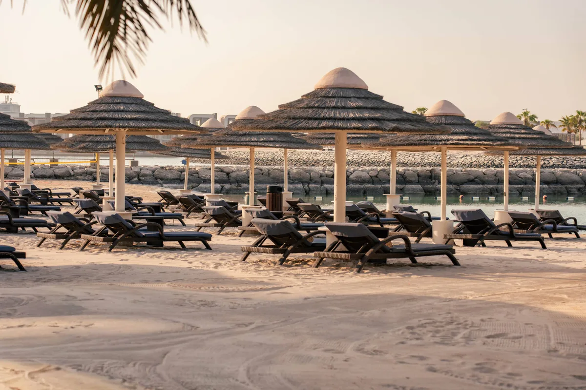 Infinity pool and garden beach at The Bayshore Beach Club, Al Bateen