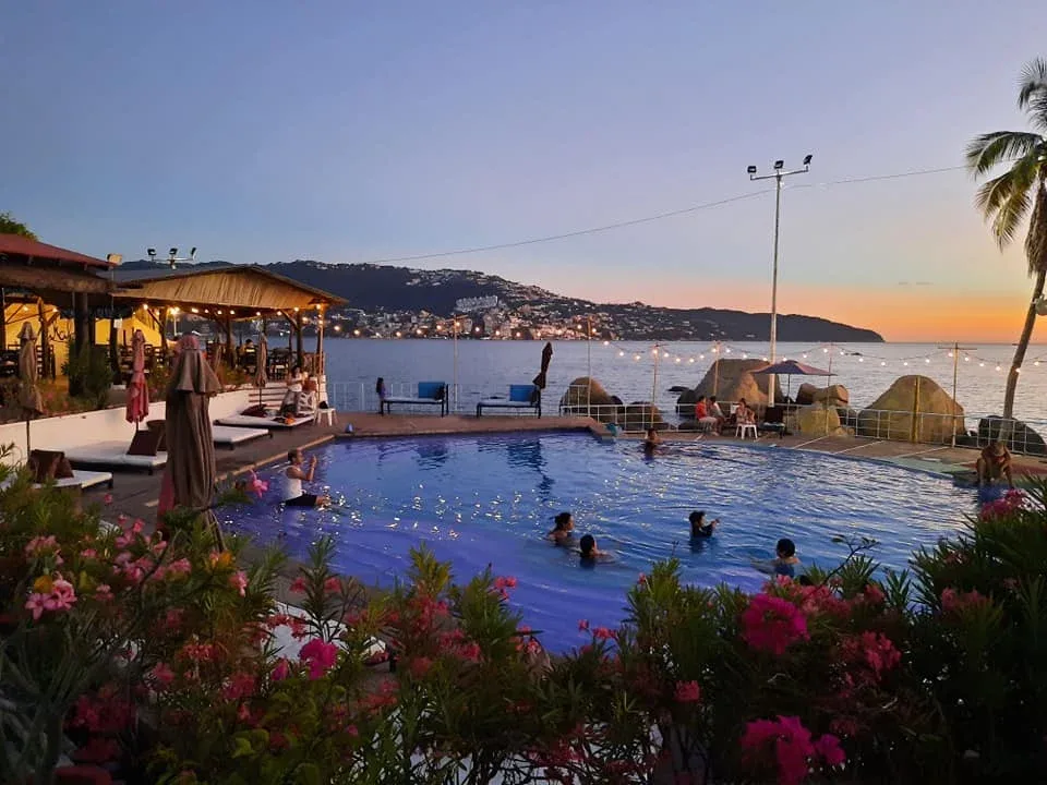 Blue-tiled pool by the sea at Mahalo Sun Beach Club, La Condesa