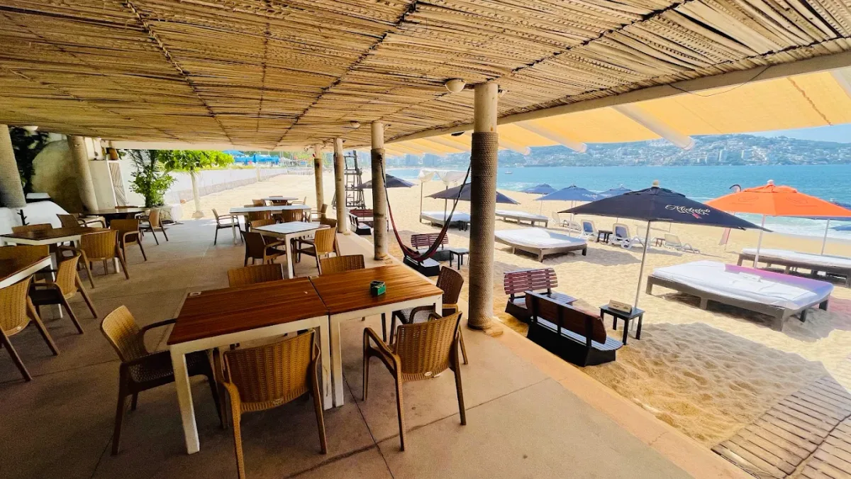 Canopied daybeds facing the water at La Playita Santa Lucia, Club Deportivo