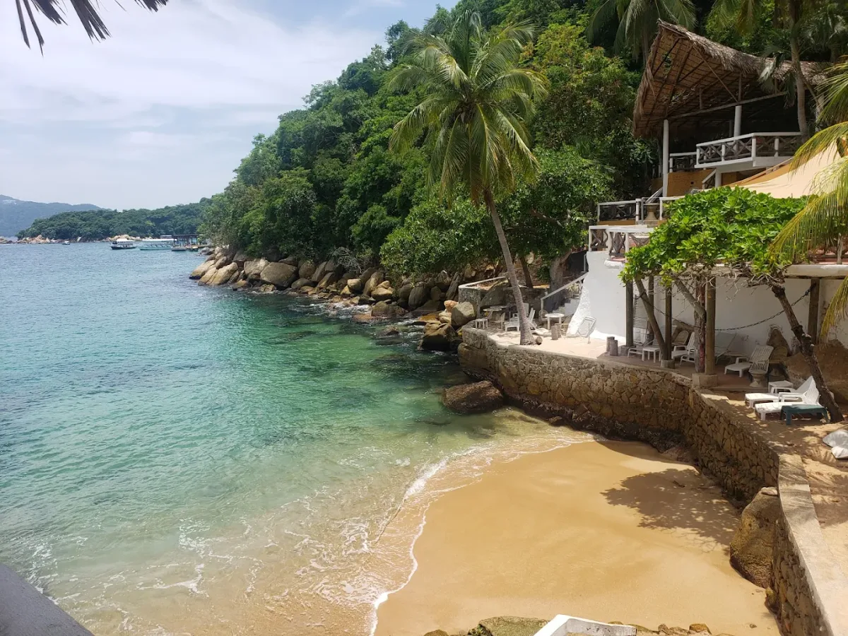 Sheltered cove and beach seating at Palao Island Club, Isla de la Roqueta