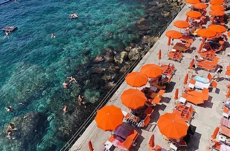 Daybeds and DJ deck at One Fire Beach, Gavitella Beach, Praiano