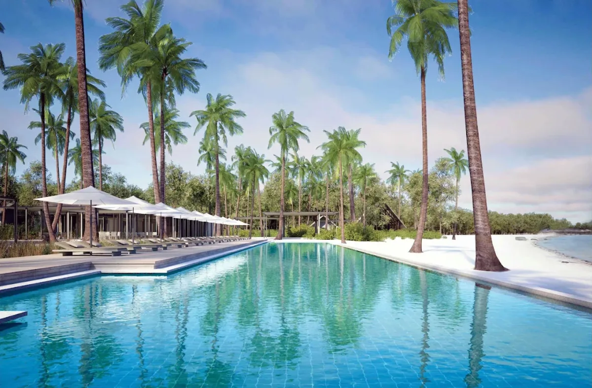 Poolside sunbeds and infinity pool at Blue Lagoon, Sheraton Belitung Resort, Tanjung Binga