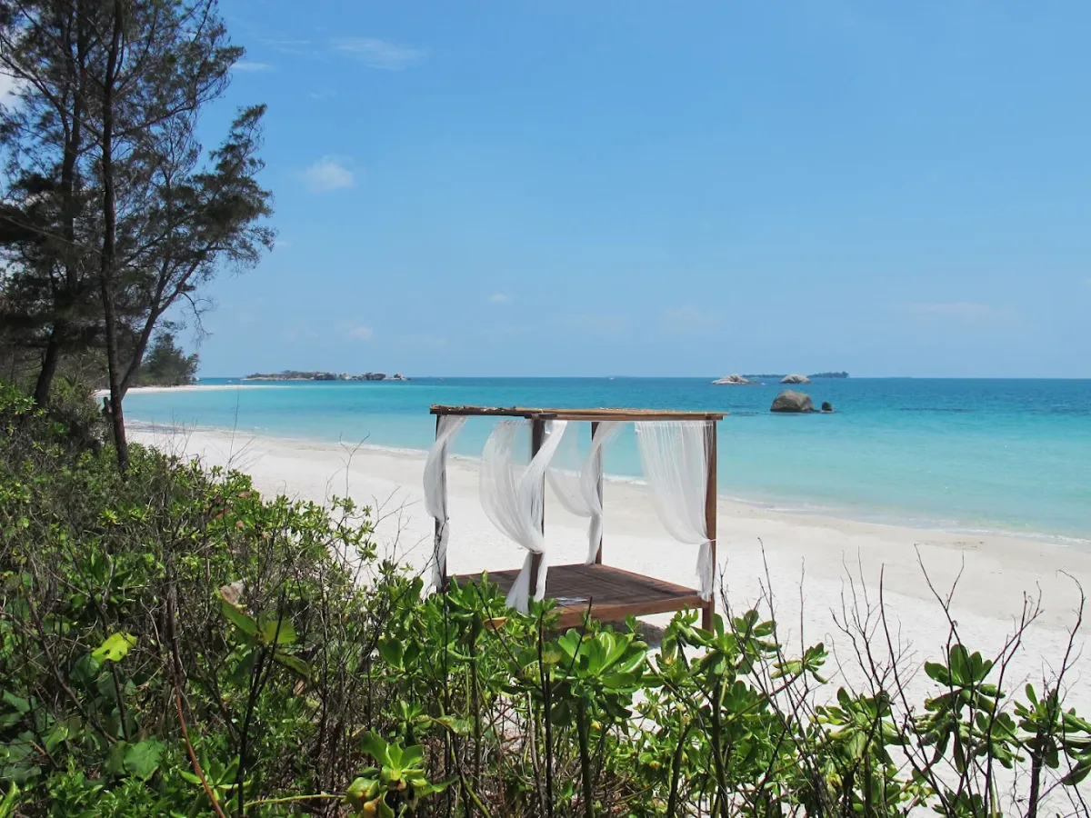 Secluded granite-lined private beach at Sahang Beachfront Cafe, Arumdalu Private Resort, Membalong