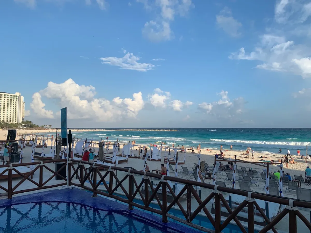 Poolside loungers and a DJ pool party at Mandala Beach Club, Playa Gaviota Azul