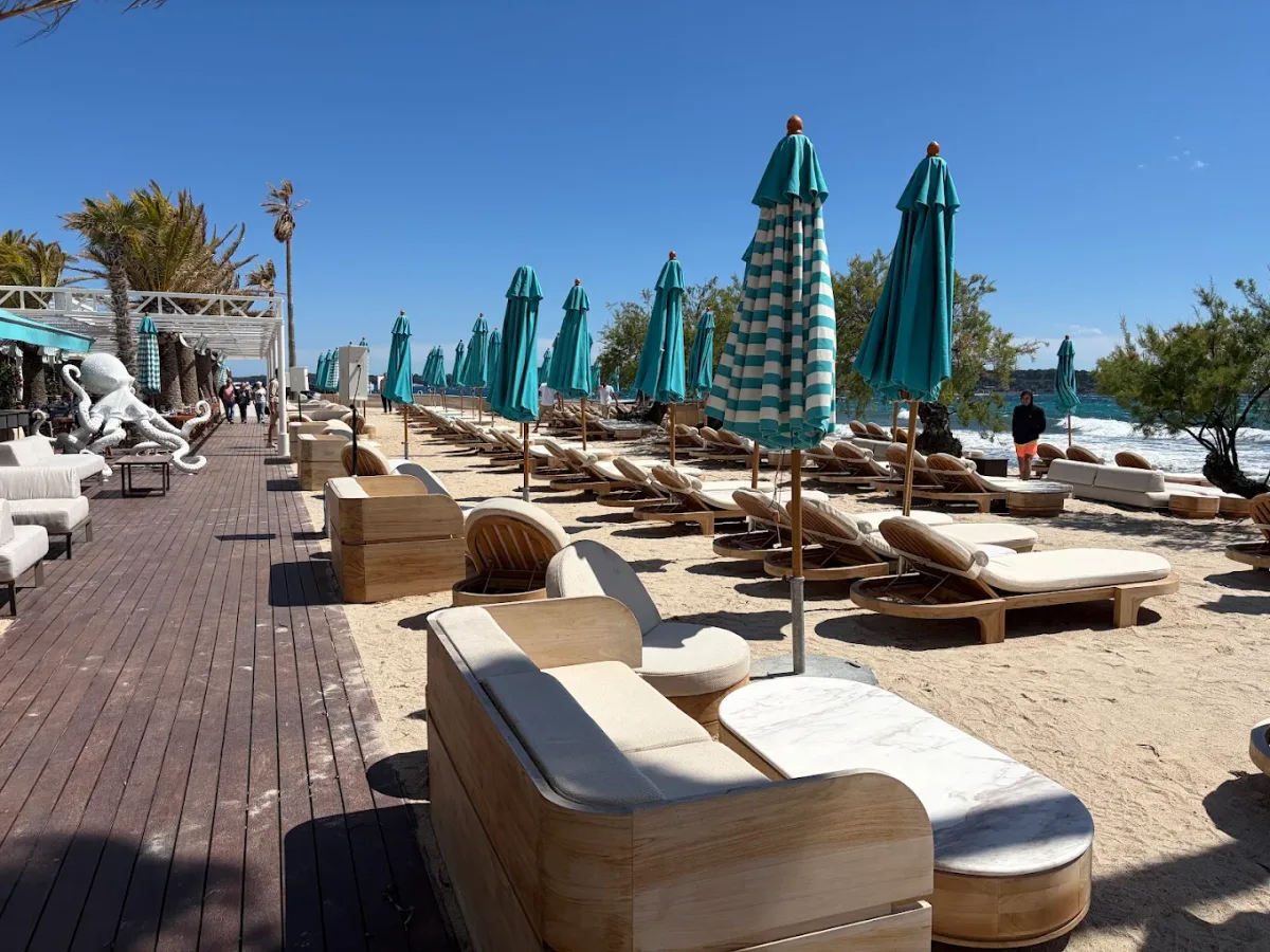 DJ-led party beach and daybeds at Nammos Cannes, Palm Beach
