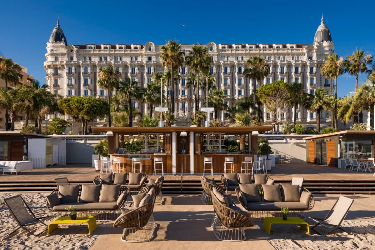 Sunbeds and pontoon on the sand at Carlton Beach Club, La Croisette