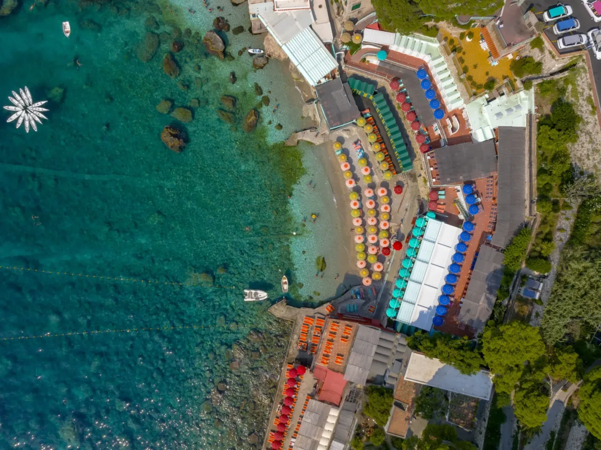 Multi-level terraces and sunbeds above the water at Bagni Internazionali, Marina Piccola