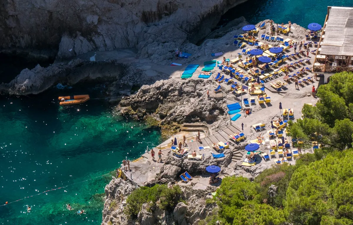 Terrace and sun loungers on the rocks opposite the Faraglioni at Da Luigi ai Faraglioni, Faraglioni
