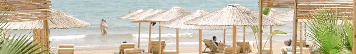 Beach loungers and DJ decks at Ammos & Ilios, Agia Marina