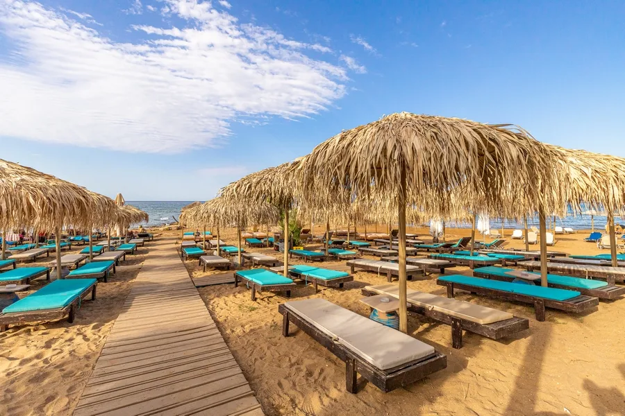Family sunbeds and playground at Almira Beach Bar, Agia Marina