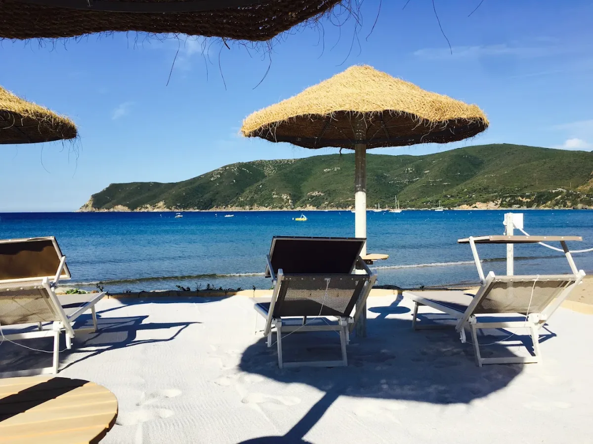 Straw umbrellas on the sand at Tortuga Beach Club, Lacona