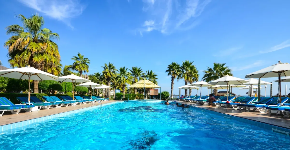 Infinity pool and loungers facing Snoopy Island at Sandy Beach Hotel & Resort, Al Aqah