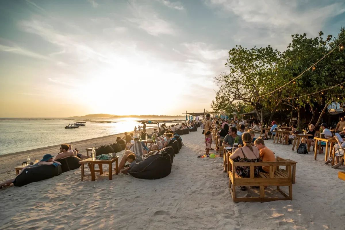 Bean bags running down the sand to the water at Mowie's, west beach Gili Air