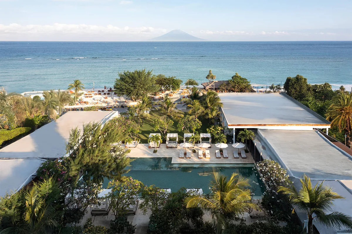 Daybeds on the sand and coastal dining at Cocana Sunset Club, Gili Trawangan sunset coast