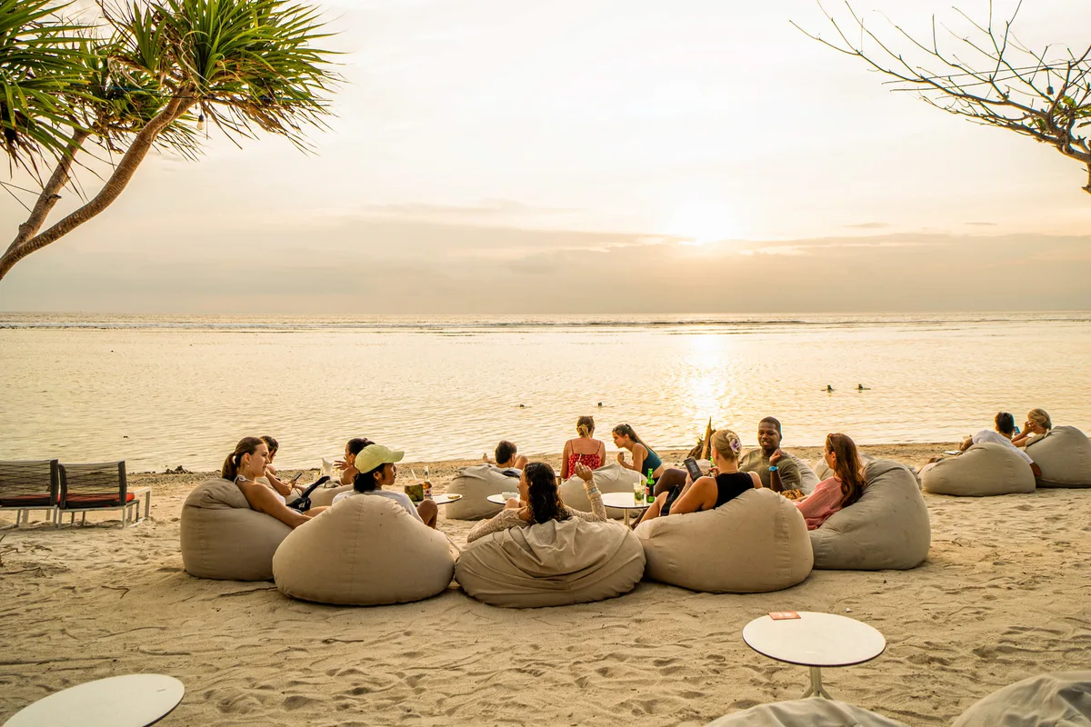 Sunset DJ set and poolside beach beds at Malibu Beach Club, Gili Trawangan sunset coast