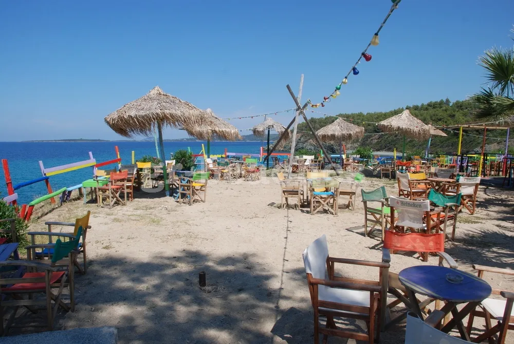 Barefoot sunset dancing on the sand at Ethnik Beach Bar, Tristinika