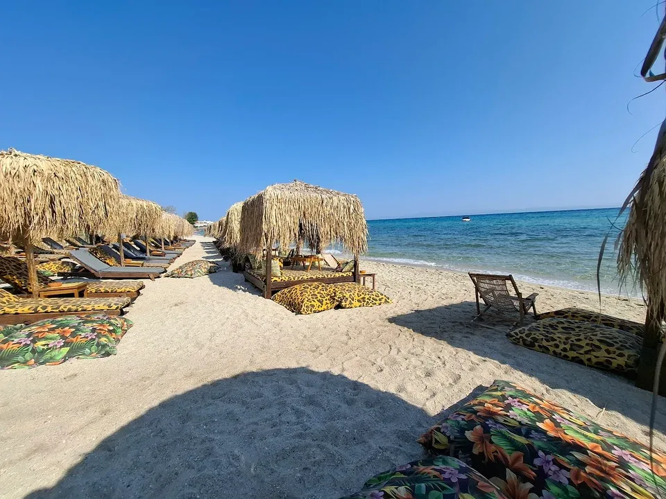 Colourful beanbags at the water's edge at Elephant Beach Bar, Pefkohori