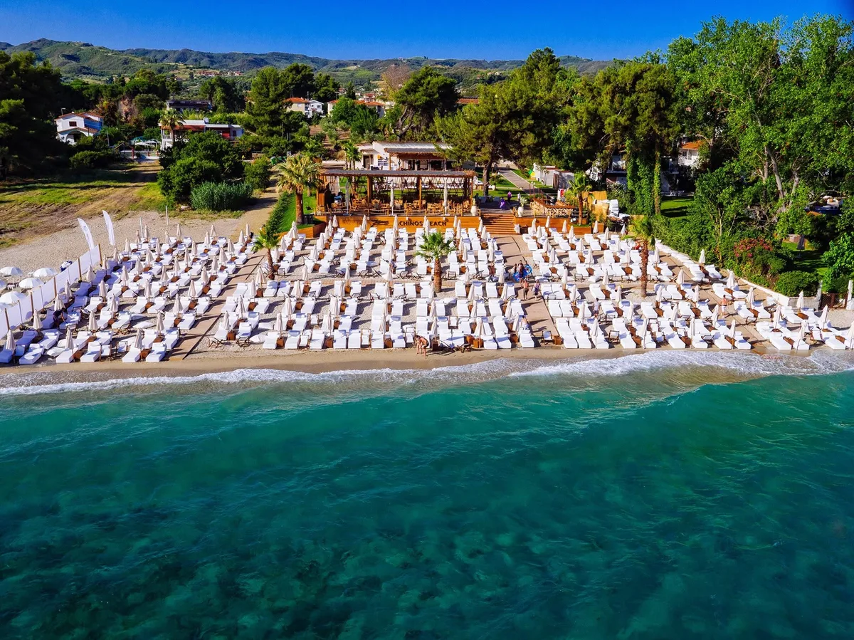 Palm trees and hanging swings at Achinos Beach - 7 Seas, Hanioti
