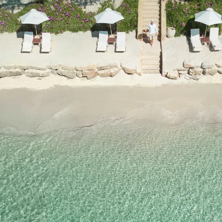 Private white-sand beach and loungers at Sani Club, Kassandra