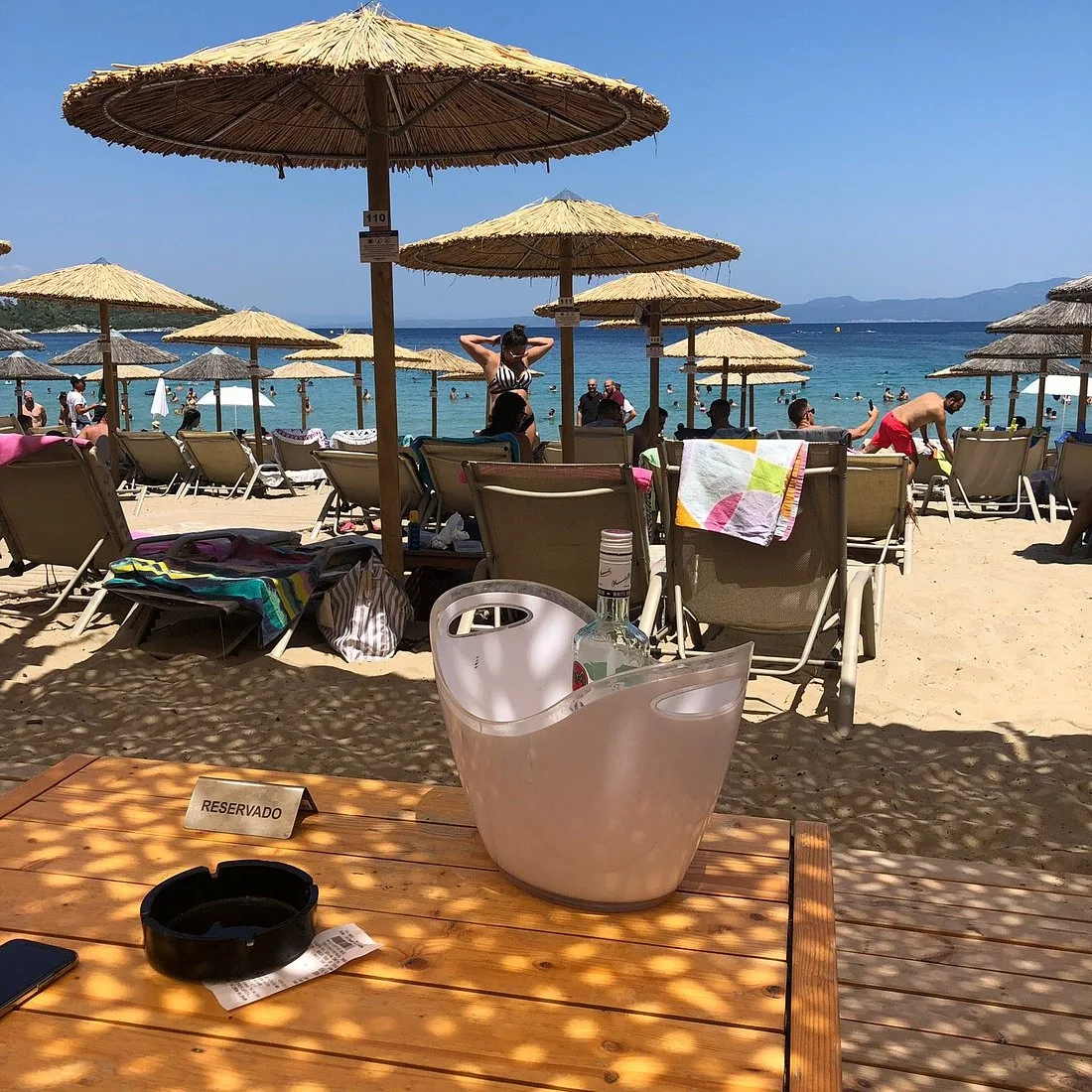 Wide open sandy beach and loungers at Koursaros Beach Bar, Paliouri
