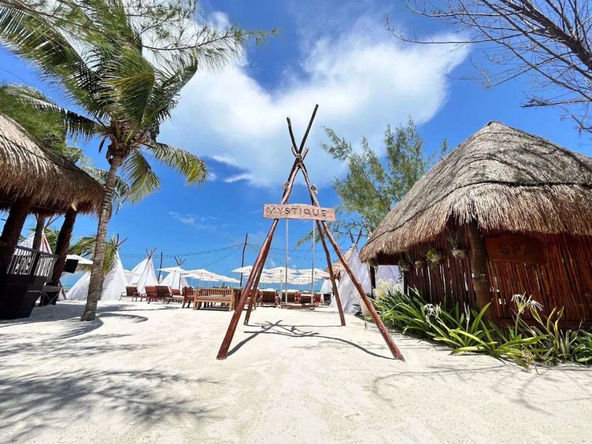 Tipis and loungers on the sand at Mystique Holbox by Royalton