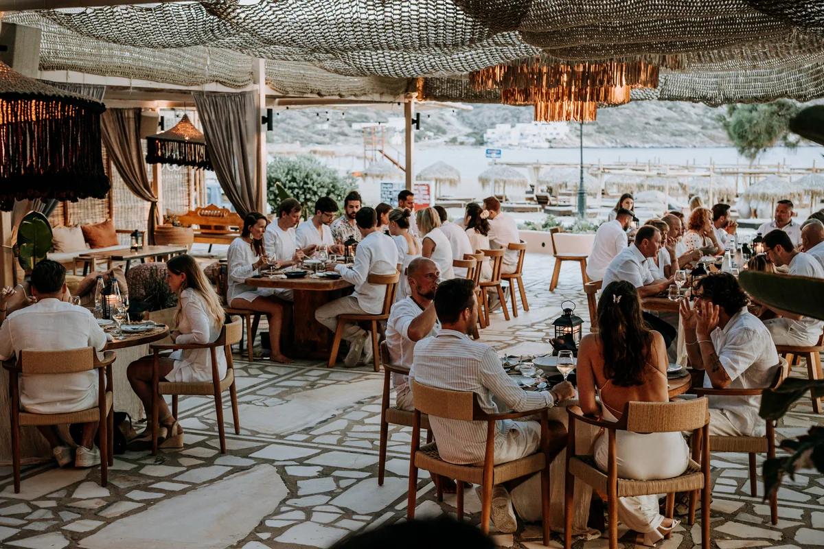 Beachfront cabanas and umbrellas in front of the restaurant at Bamboo Ios, Mylopotas Beach
