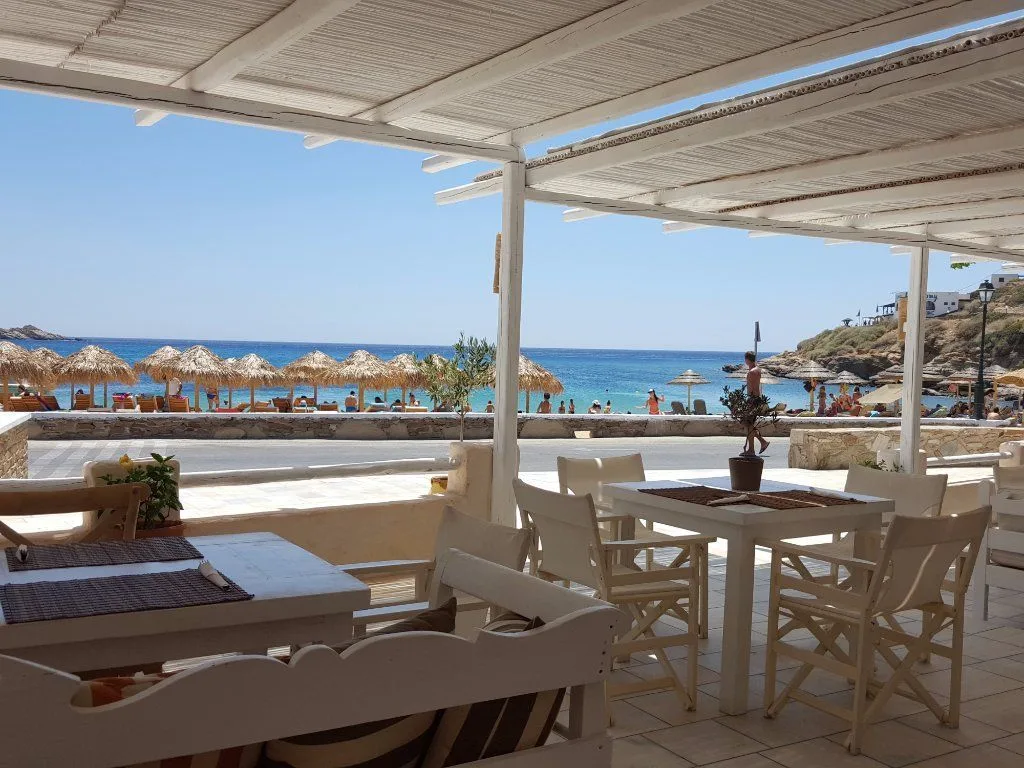 Swinging beds and bamboo-ceiling bar at the far end of Mylopotas Beach at Salt Restaurant Bar