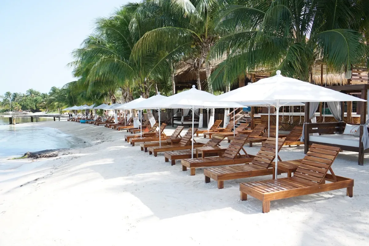 Saltwater pool and sunbeds overlooking the water at Zaza Yacht & Beach Club, Punta Sur