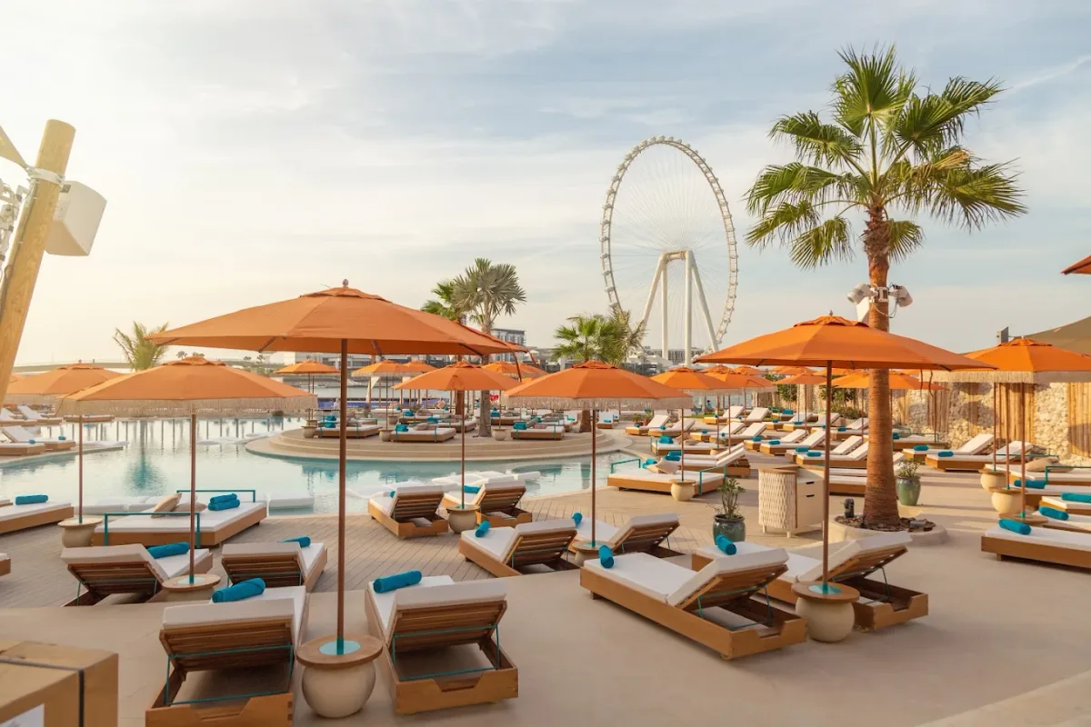 Infinity pool and beach club by day under the Dubai Eye at Bla Bla Dubai, The Beach, JBR