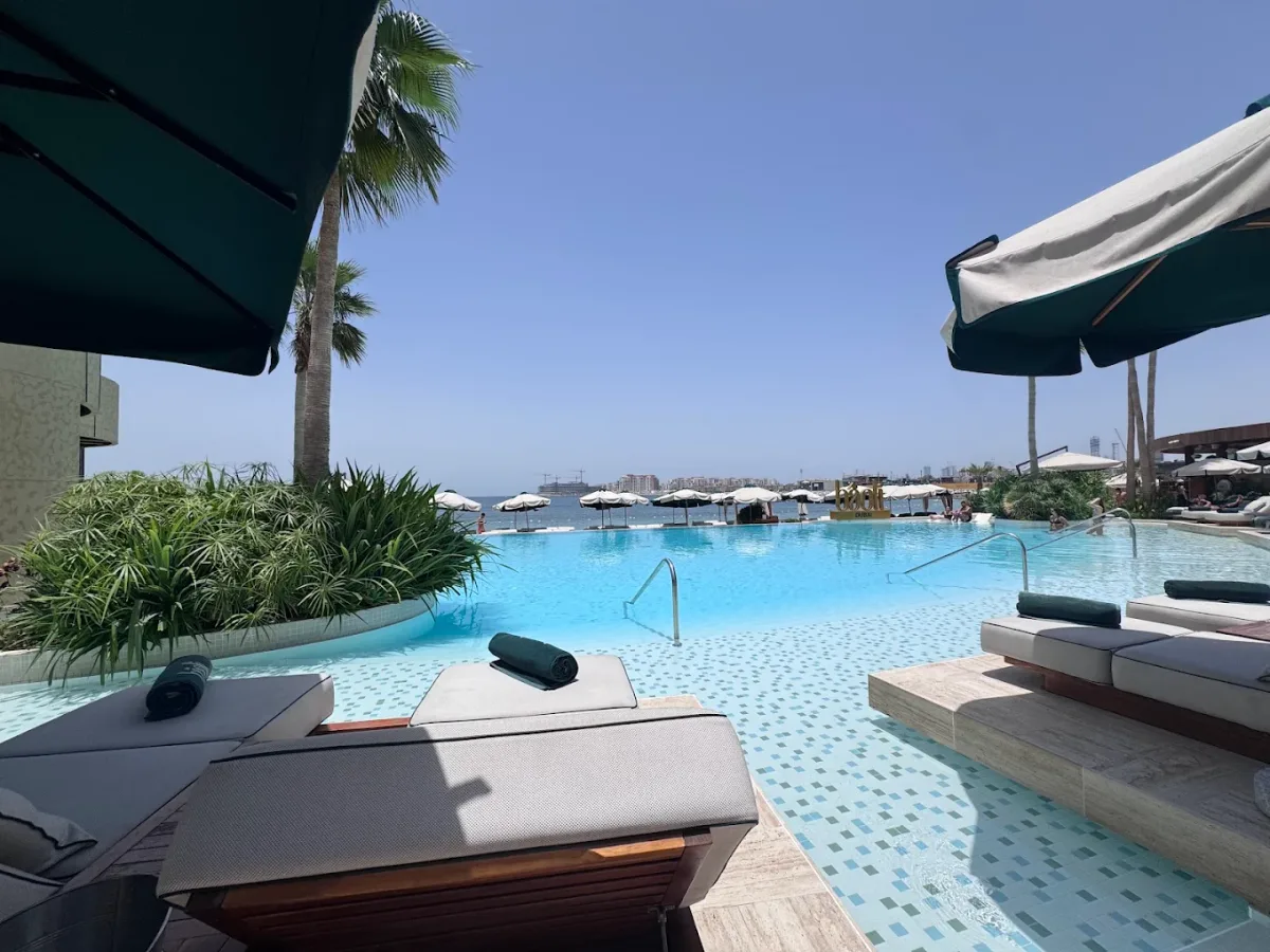 Jungle-themed pool and sunset lounge at Bâoli Dubai, J1 Beach
