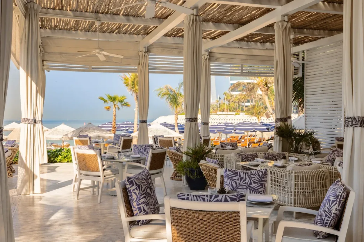 Private beach and pool with Burj Al Arab view at Summersalt Beach Club, Jumeirah Al Naseem
