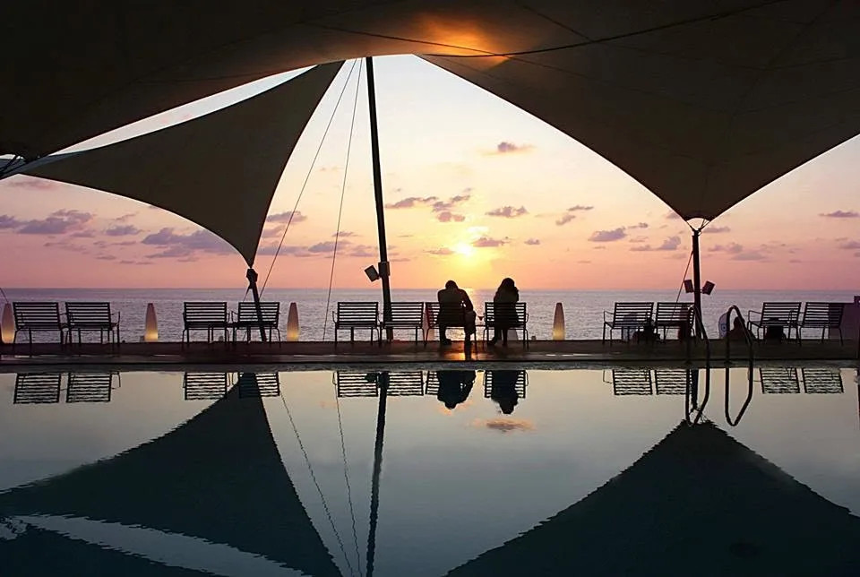 Pool deck and Mediterranean dining at Areia Club Restaurant, Kathisma Beach