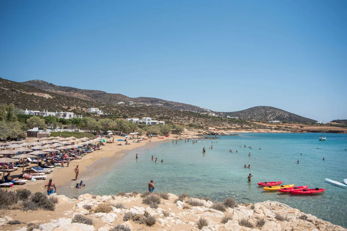 Boho sunbeds in a sheltered cove at Faragas Beach Club, near Aliki on the south coast