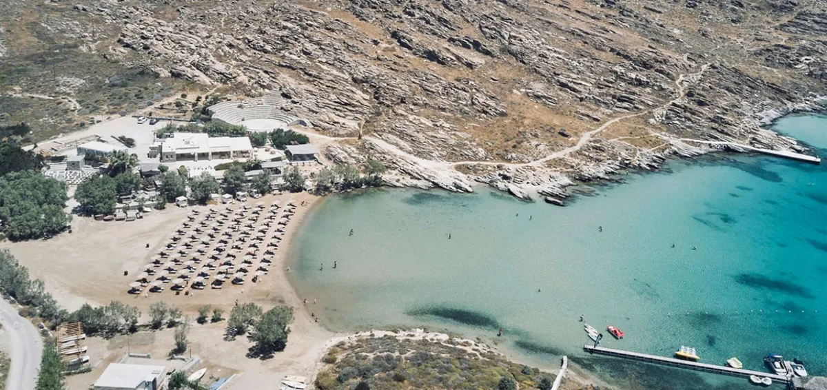 Loungers and calm bay swimming at Monastiri Beach Club, Paros Park near Naoussa