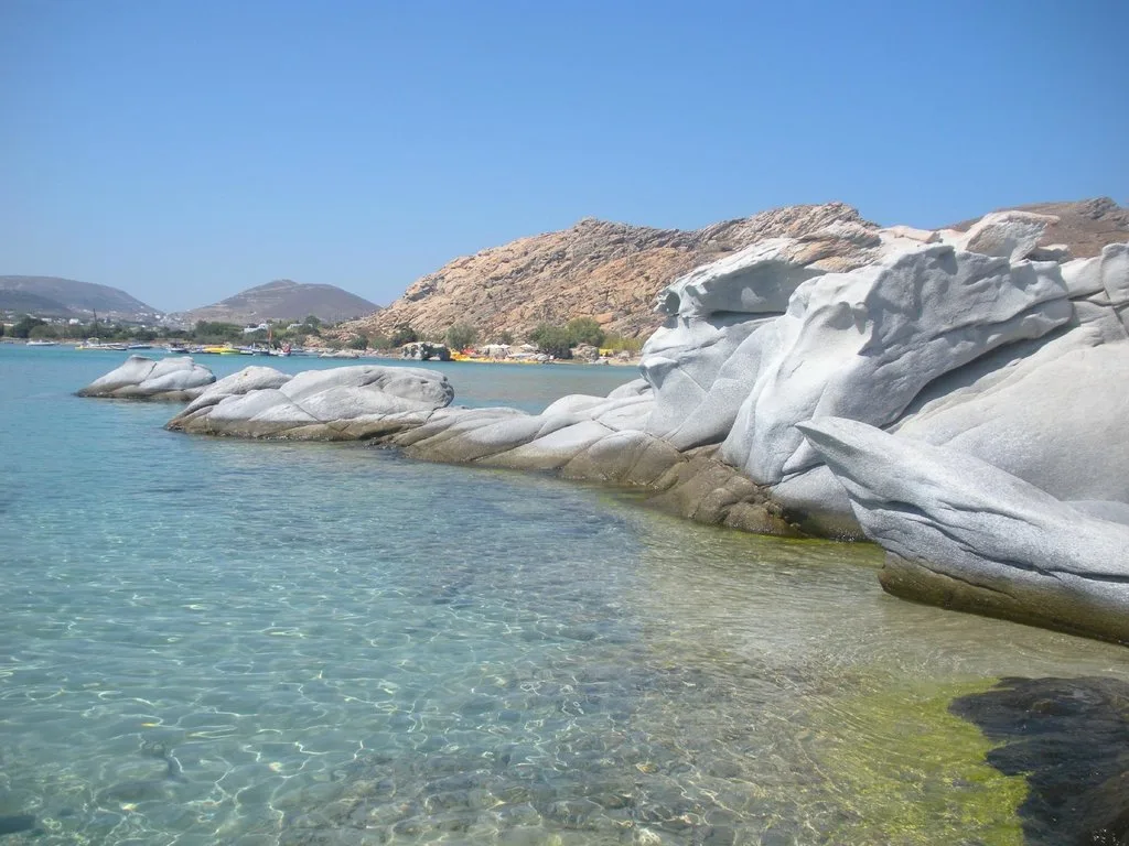 Sunbeds among the granite rock formations at Paros on the Rocks, Kolymbithres Beach