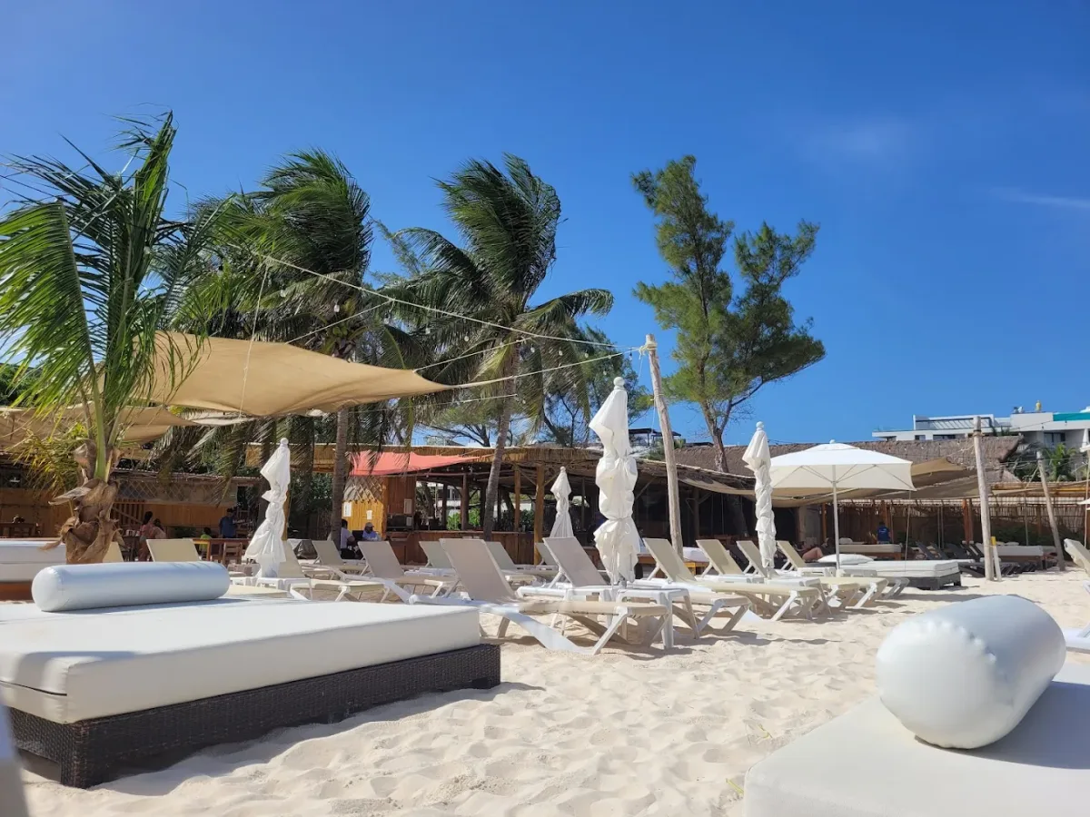 Balinese beds and hammocks on the sand at Encanto Beach Club, Coco Beach