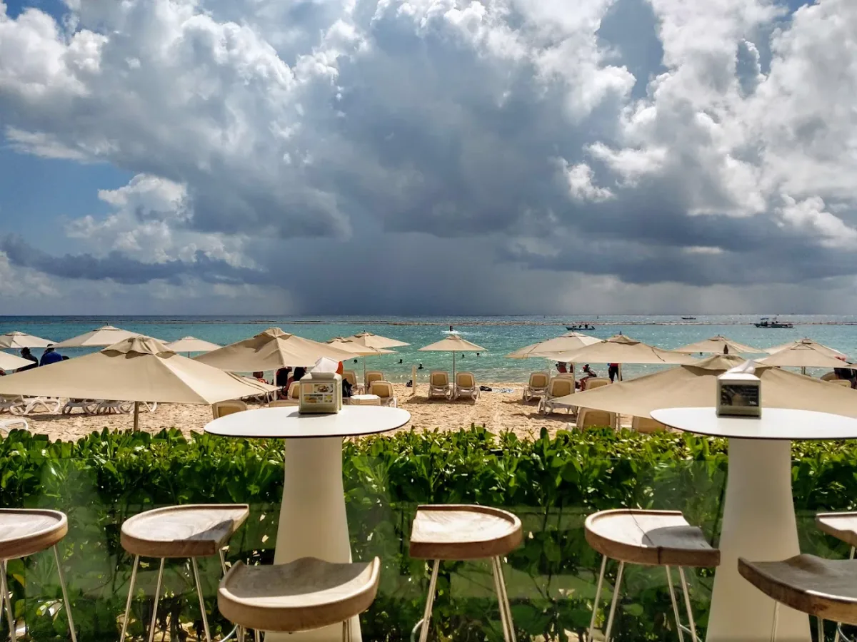 Loungers, pool and DJ booth on the sand at Mamitas Beach Club, Playa Mamitas
