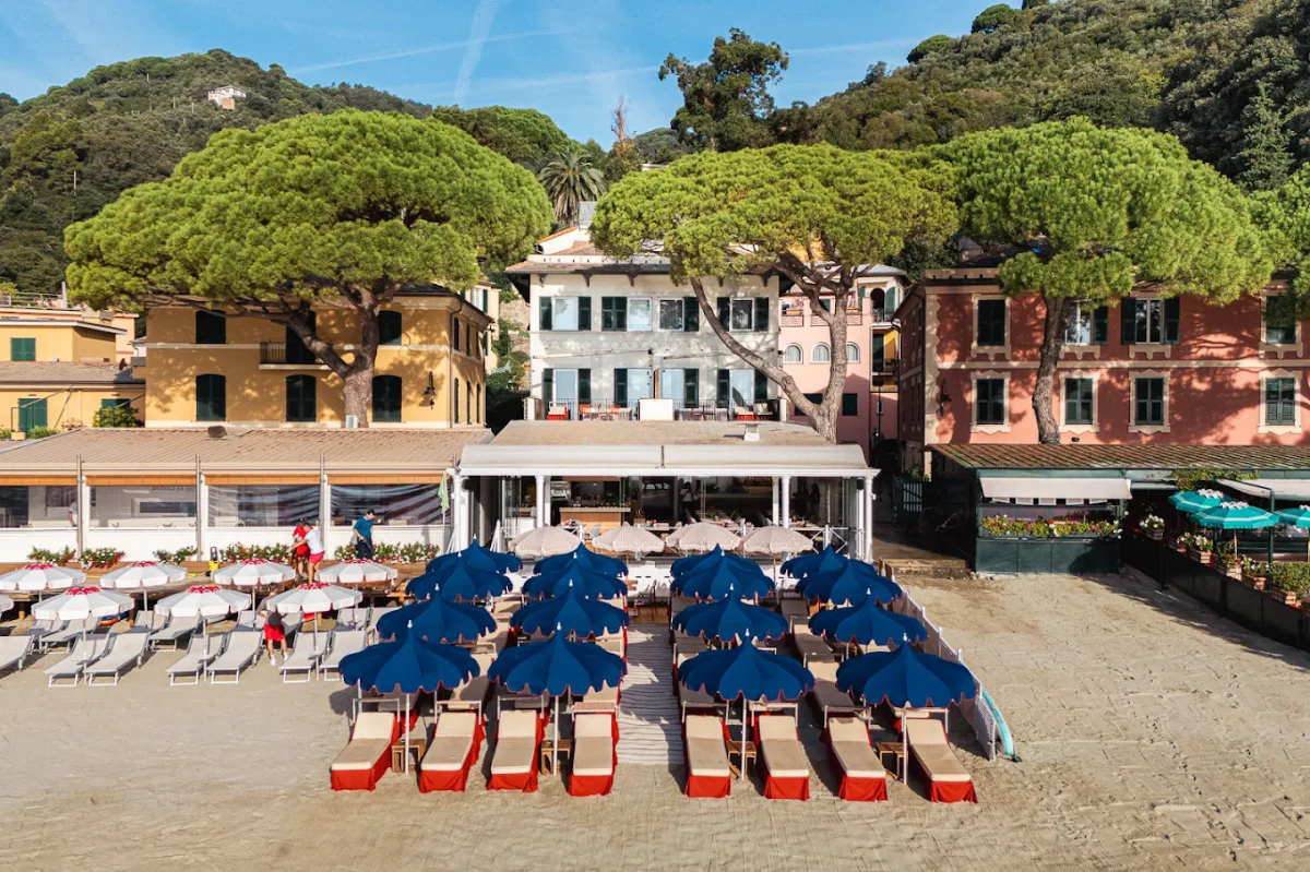 Small private hotel beach with loungers at Eight Hotel Paraggi, Baia di Paraggi
