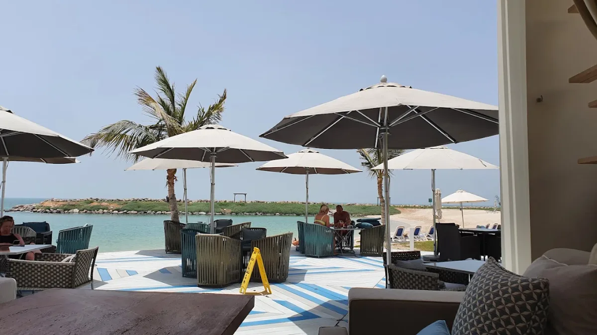 Al fresco beach lounge with sunset drinks at SOL, Hilton Ras Al Khaimah Beach Resort