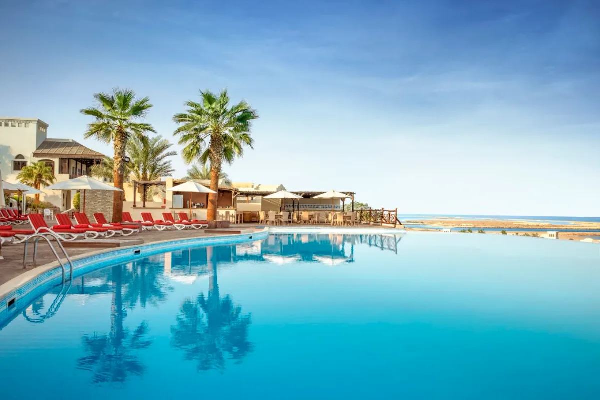 Private cove with infinity pools and a long Arabian Gulf beach at The Cove Rotana