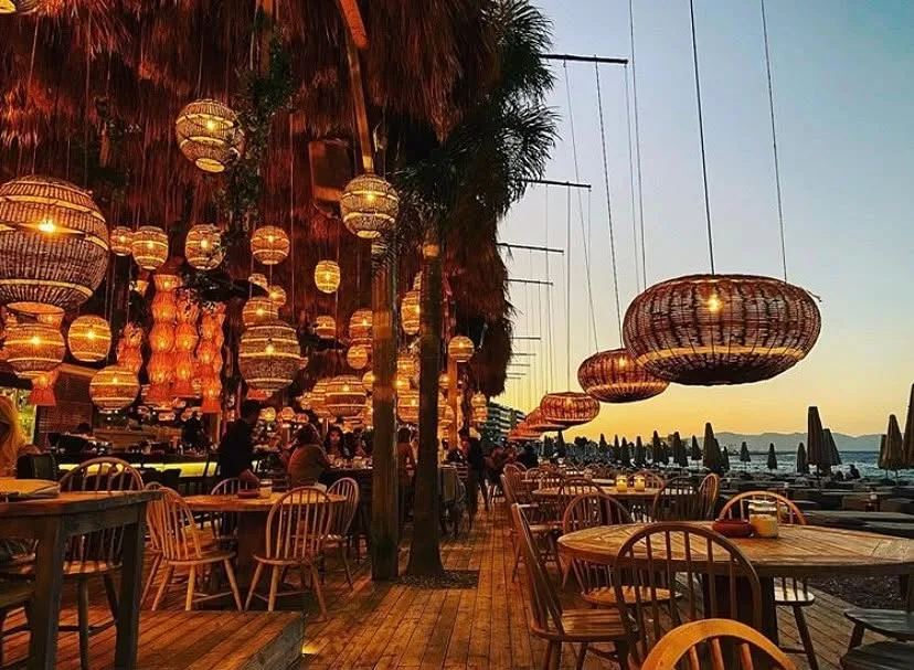 Tiki umbrellas and loungers at Ronda on Elli Beach, Rhodes Town