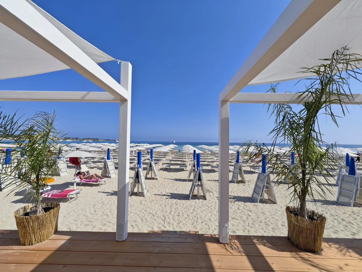 Full-service sunbeds under Monte Monaco at Lido Al Sabbione, San Vito main beach