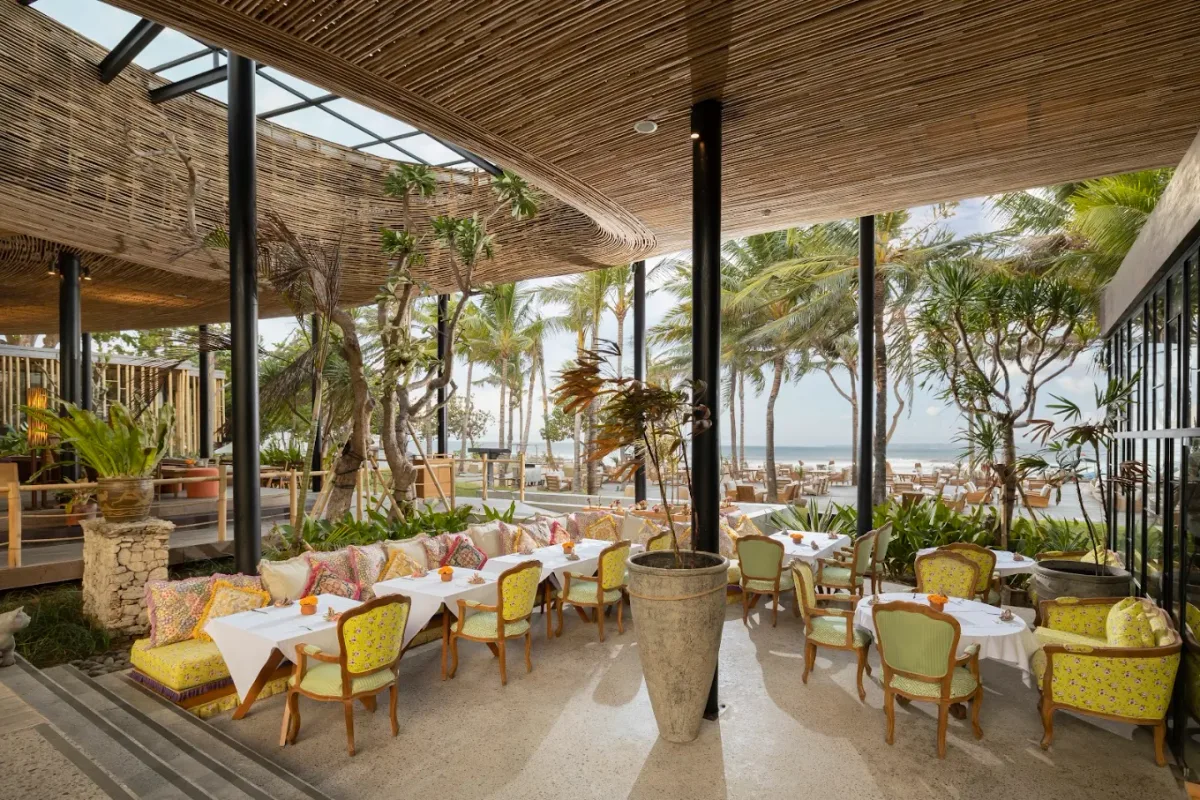 Poolside loungers and beach-house setting at Byrd House Beach Club, Sanur