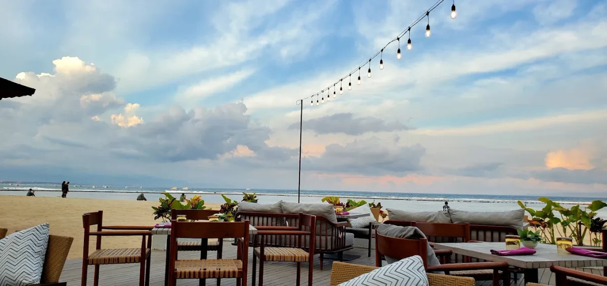 Sunset daybeds on the sand at Bali Beach Bar & Grill, The Meru Sanur