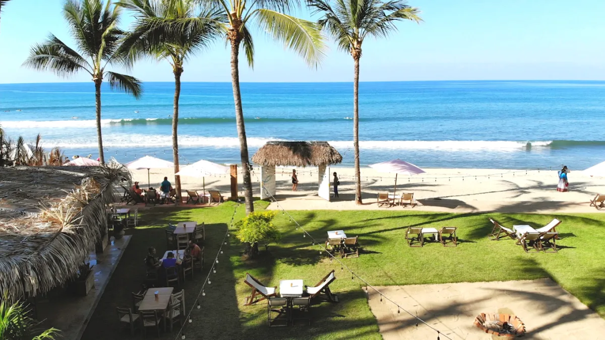 Garden terrace overlooking the north point surf break at Frente al Punto Beach Club, Playa Azul