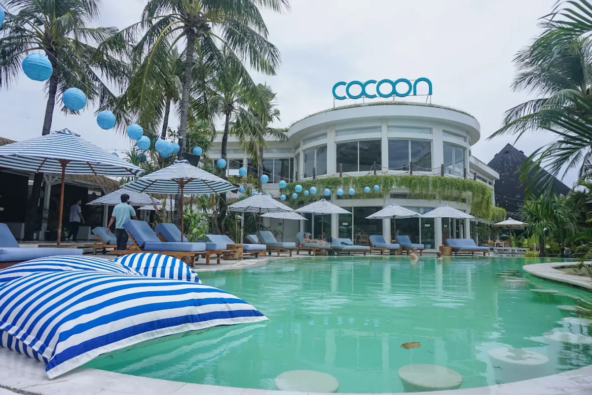 Pool with daybeds and cabanas at Cocoon Beach Club, Double Six