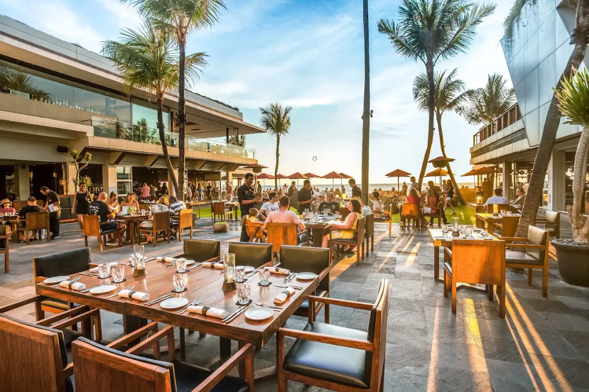 Tiered decks on the sand facing the sunset at Ku De Ta, Seminyak Beach