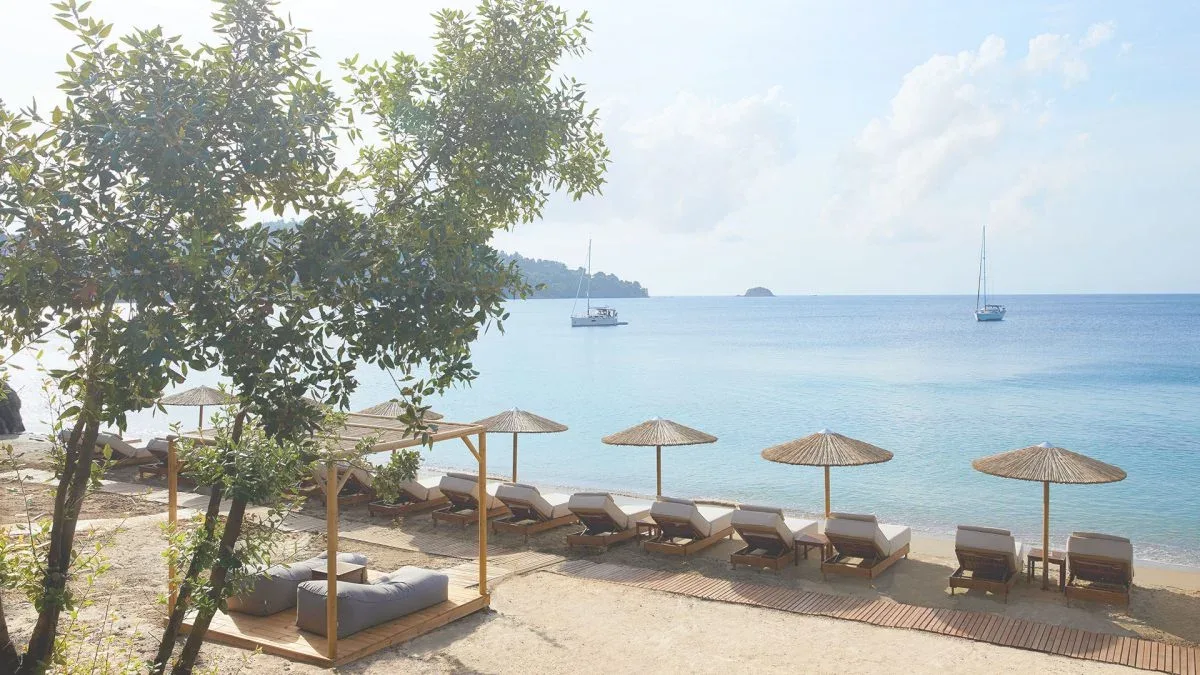 Calm resort loungers on a sheltered bay at Grace Beach Bar, Ambelakia