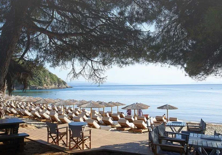 Upbeat music and sunbeds on a small cove at Black Bird Beach Bar, Little Banana
